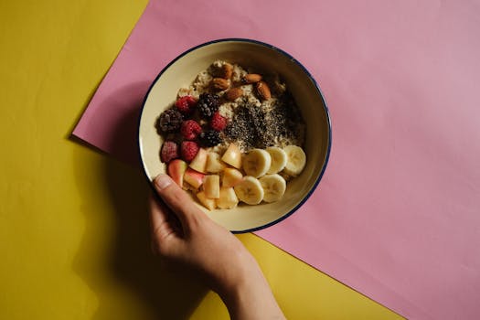 a bowl of oatmeal with fruits and nuts