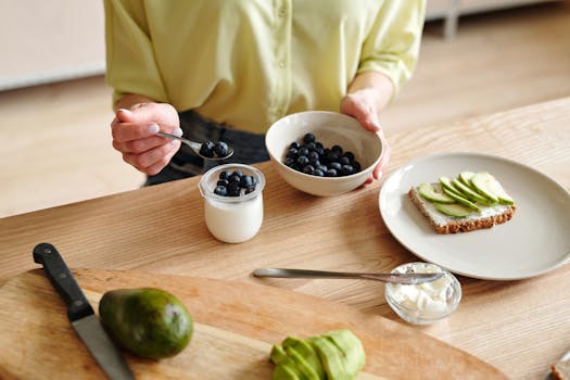 healthy breakfast spread with eggs, avocado, and fruit