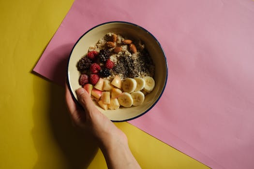 bowl of oatmeal with nuts and berries