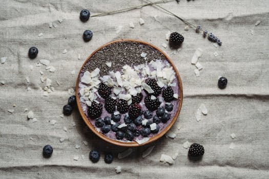 colorful smoothie bowl with fruits and seeds