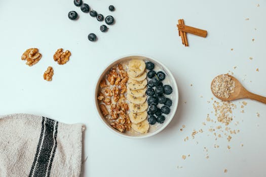 a bowl of oatmeal topped with fruits and nuts