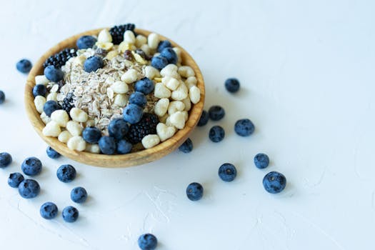 bowl of oatmeal topped with fruits